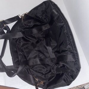 A•new•day black and gold weekend/travel bag